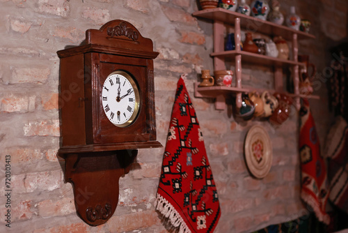 Wooden wall clock with pendulum.