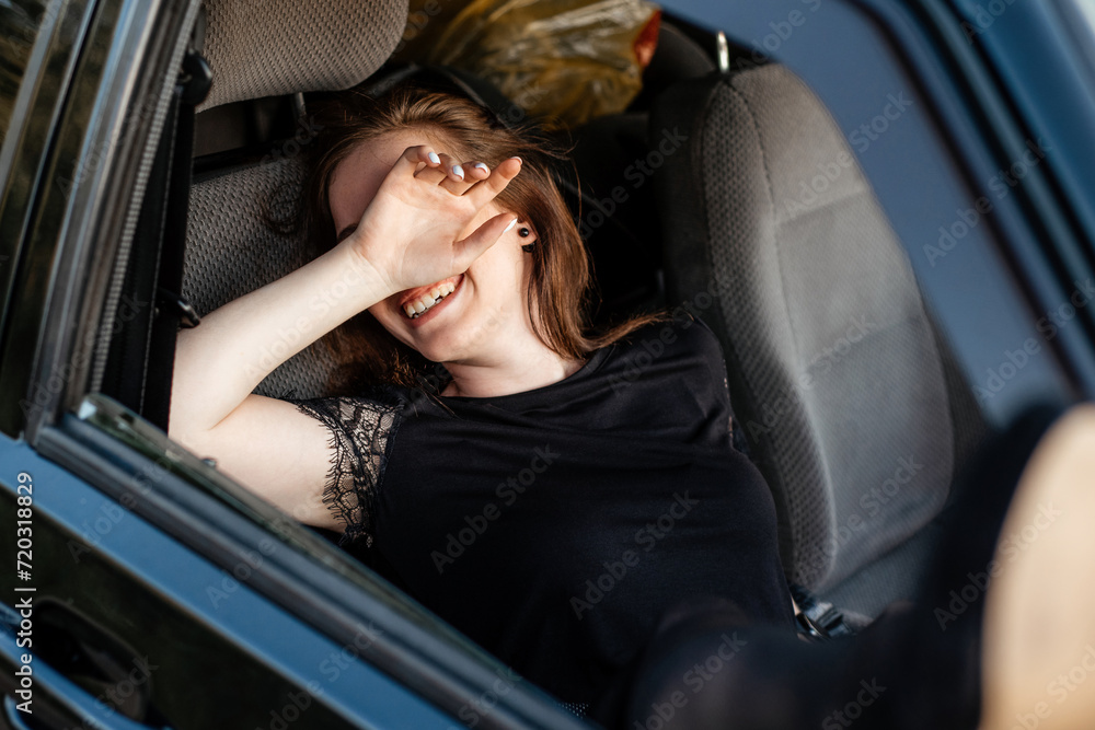 sexy girl driving a car. the girl pulled her legs out of the car window.girl laughs and flirts. sexy legs in pantyhose sexy girl driving a car. the girl pulled her legs out of the car window.girl laughs and flirts. sexy legs in pantyhose