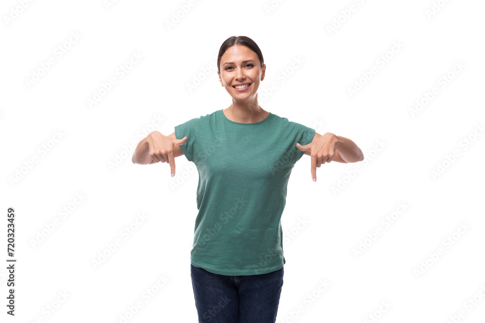 young black-haired woman dressed in a basic t-shirt shows her hand down in surprise young black-haired woman dressed in a basic t-shirt shows her hand down in surprise