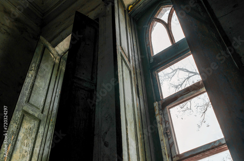 view from the window of an abandoned abandoned house in Ukraine photo