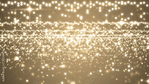 Beautiful golden background with flying particles. light shine particles bokeh, holiday concept. Seamless loop.