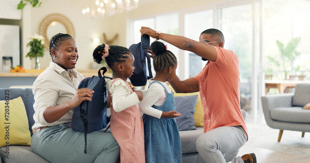 Obraz premium Morning, talking and a black family ready for school, preparation and helping with bags. Happy, care and children with help from an African mother and father for kindergarten in a home living room