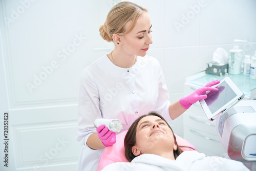 Professional procedure, female working with customer in clinic
