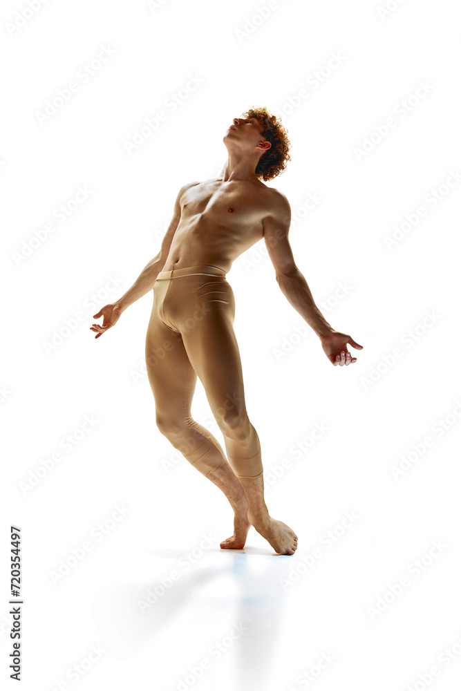 Time of ballet. Contemporary dance choreographer and dancer freeze in moment of his performance against white background. Art, motion, action, inspiration concept. Natural beauty of male body. Time of ballet. Contemporary dance choreographer and dancer freeze in moment of his performance against white background. Art, motion, action, inspiration concept. Natural beauty of male body.