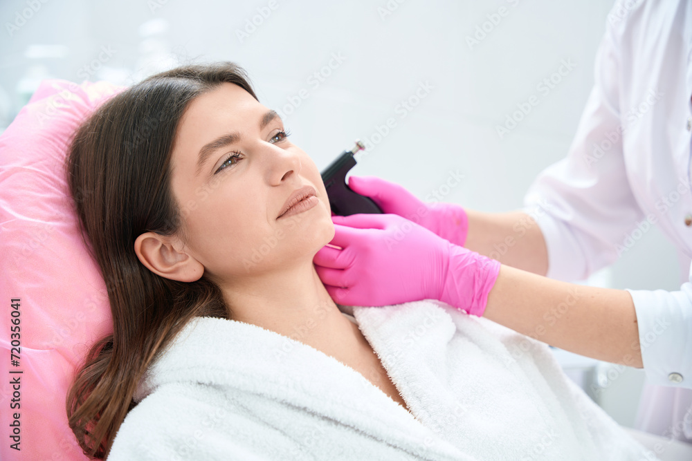 Body care procedure, cosmetologist working in clinic of aesthetic medicine Body care procedure, cosmetologist working in clinic of aesthetic medicine
