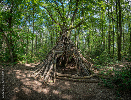 Dardilly, France - 09 03 2022: View of a wooden teepee in the forest Bois de Serre, Edge of the woods. photo