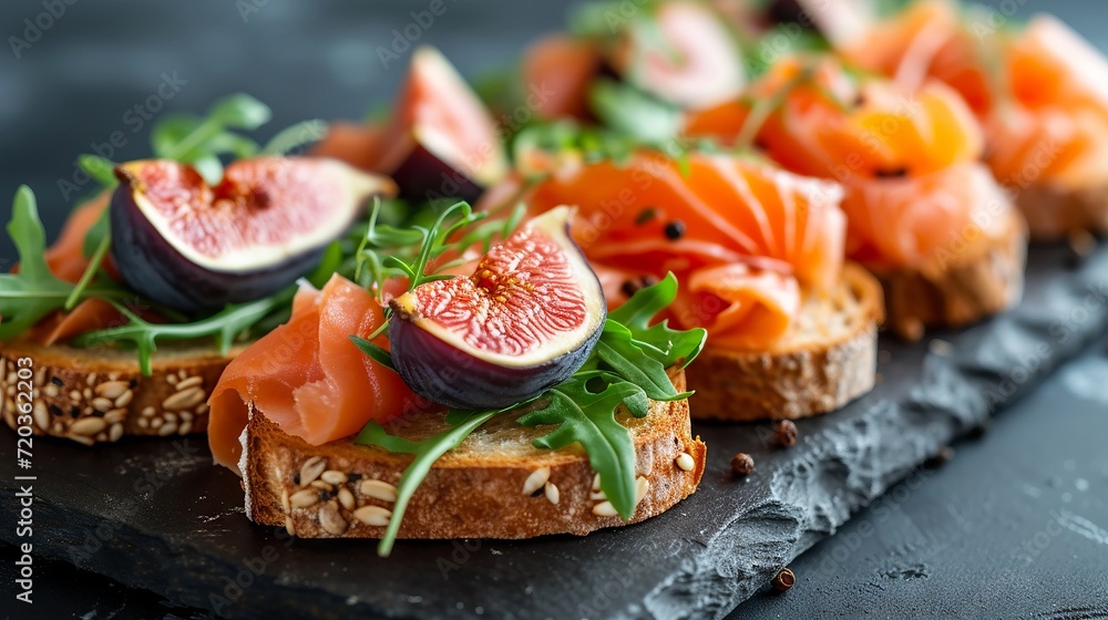 Gourmet toasts with salmon, figs, and various toppings Gourmet toasts with salmon, figs, and various toppings