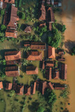Fictional aerial view of a flooded village, climate change impact