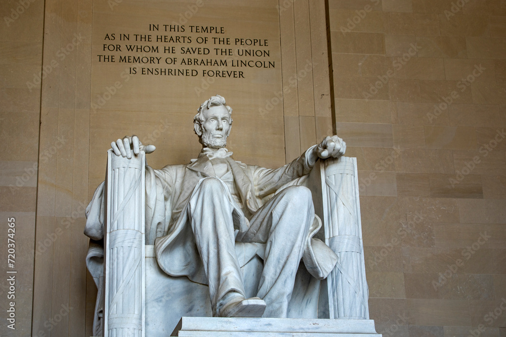 Abraham Lincoln with his typical phrase, at the Lincoln Memorial, is the Georgia white marble statue of the 16th American president, sitting in his armchair on the National Mall in Washington DC (USA)