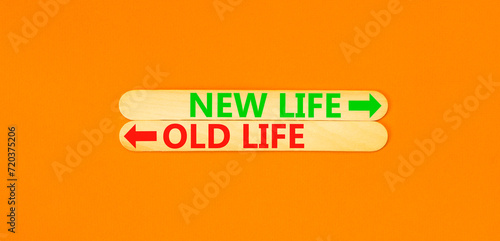 New or old life symbol. Concept word New life Old life on beautiful wooden stick. Beautiful orange table orange background. Business and new or old life concept. Copy space.