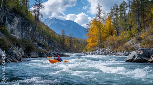 kayaker with whitewater kayaking, down a white water rapid river in the mountain