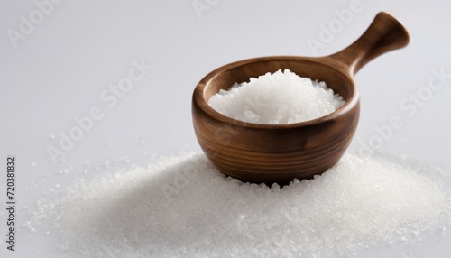 A wooden bowl filled with salt