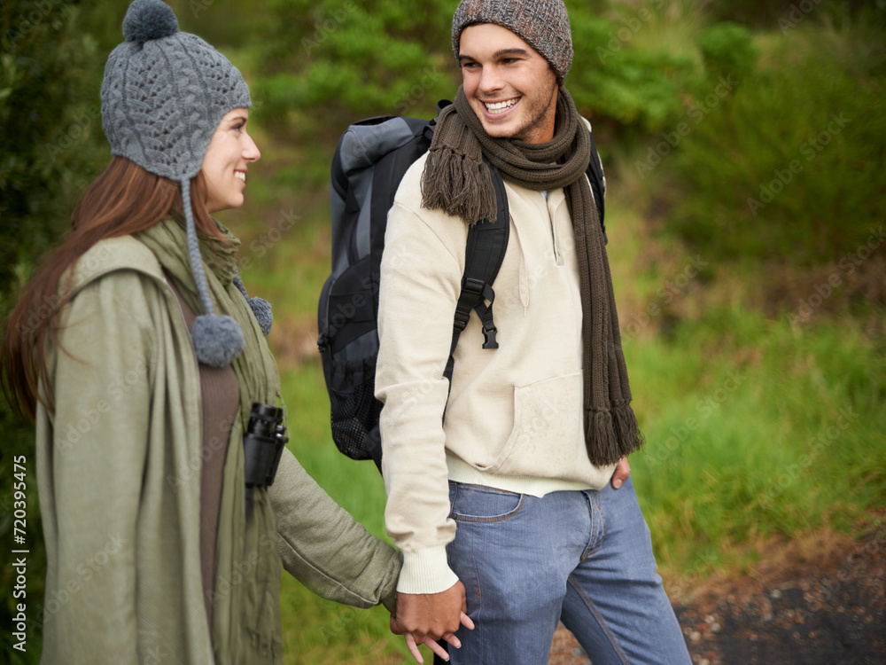 Forest, hiking and happy couple for holding hands, mountain and travel with backpack, nature and bonding. Outdoor, adventure and trekking in path, woods and winter for travelling and explore Forest, hiking and happy couple for holding hands, mountain and travel with backpack, nature and bonding. Outdoor, adventure and trekking in path, woods and winter for travelling and explore