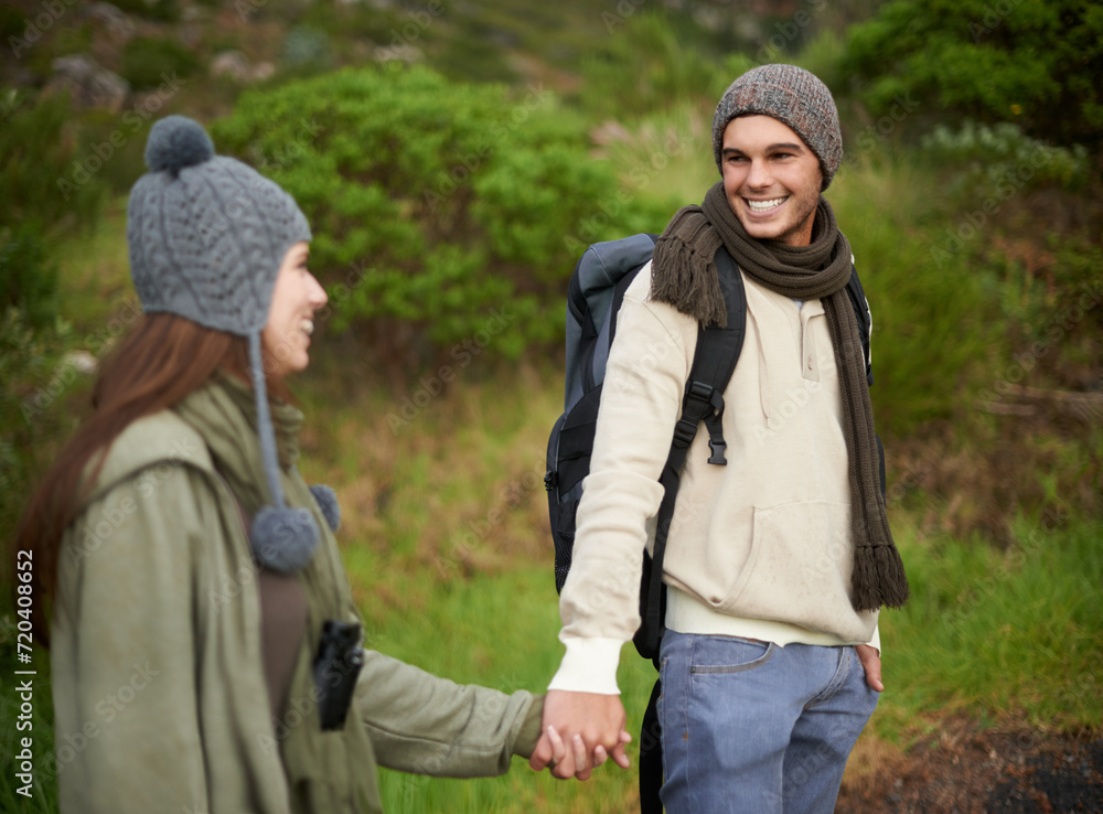 Woods, hiking and happy couple holding hands on mountain and travel with backpack, nature and bonding. Outdoor, adventure and trekking in path, forest and winter for travelling and explore together Woods, hiking and happy couple holding hands on mountain and travel with backpack, nature and bonding. Outdoor, adventure and trekking in path, forest and winter for travelling and explore together