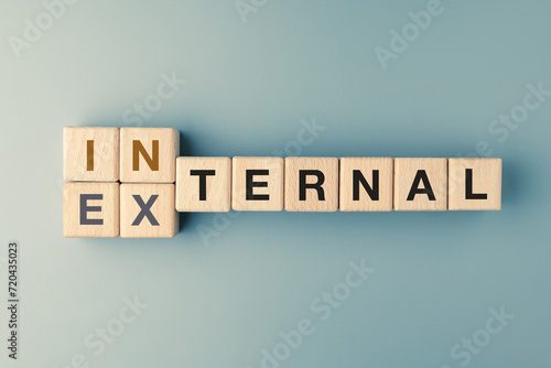 Internal versus external concept text on alphabet wood blocks photo