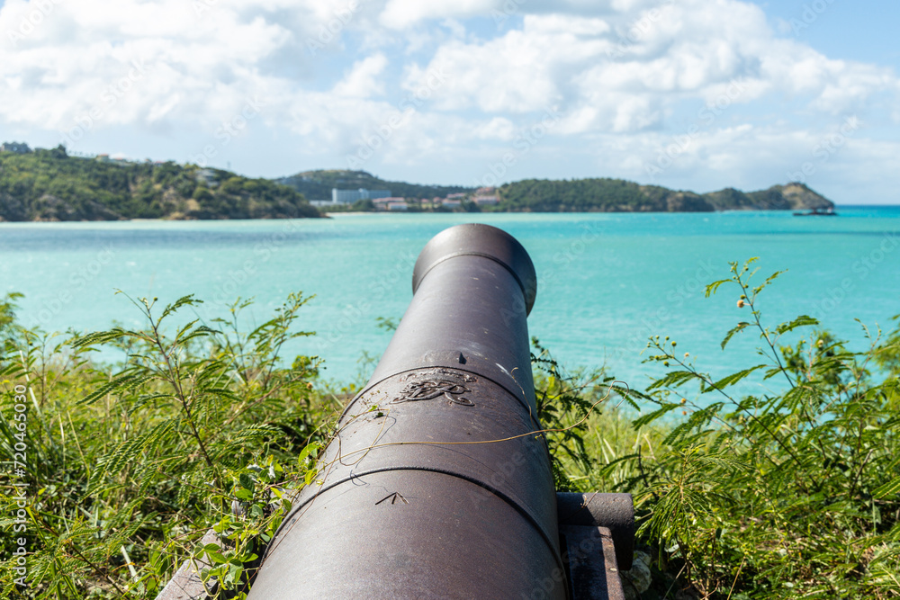 An ancient cannon pointed toward the harbor at Fort James on the island of Antigua in the Caribbean. An ancient cannon pointed toward the harbor at Fort James on the island of Antigua in the Caribbean.