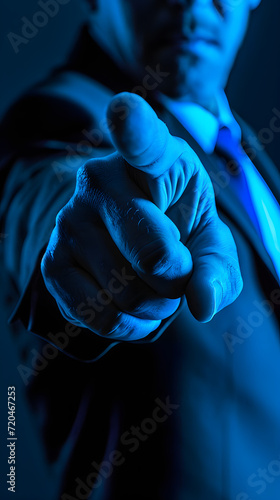 businessman in suit pointing an index finger