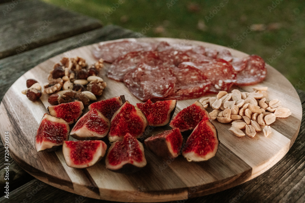 figs and meat on a board