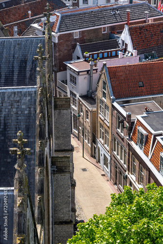 High angle view from the roof of St John's Church in Gouda, The Netherlands, the longest church in the Netherlands with 16th-century stained-glass towards historic buildings behind church