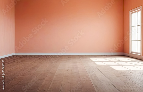 A brightly lit empty peach-colored room with highlights on the walls and a wooden floor. Product presentation.