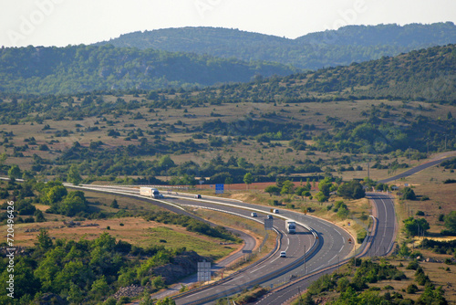 Autoroute A75, causse du Larzac, et collines calcaires vers le pas de l'Escalette, réseau routier, infrastructures autoroutières, Hérault, Languedoc Roussillon Sud de la France photo