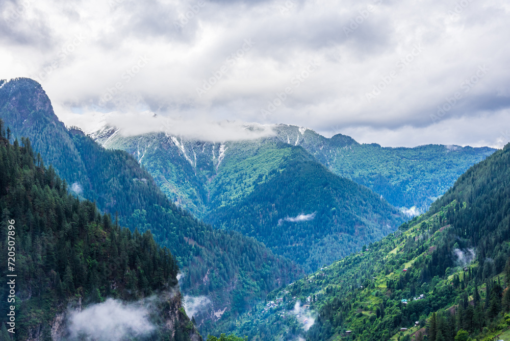 Panoramic view of Himalayas mountains from jhaka village enroute Rupin Pass trail in Shimla district of Himachal Pradesh, India.