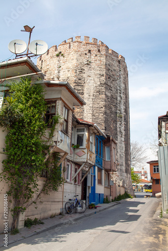 View of old houses with Yedikule Fortress background in Istanbul, Turkey. photo