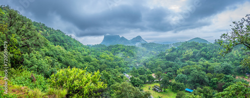 Panoramic view of Pachmarhi valley having clouds and mist shrouded hills rolling on each other from Chaudeshwar Mahadev Temple road in Pachmarchi, Madhya Pradesh, India.