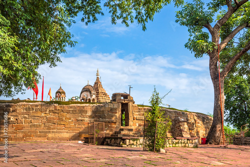 Chausath Yogini or 64 Yoginis temple is a religious centre located atop a hill built of granite and sandstone and depicts architectural precision of that era constructed by the Kalchuri dynasty. photo