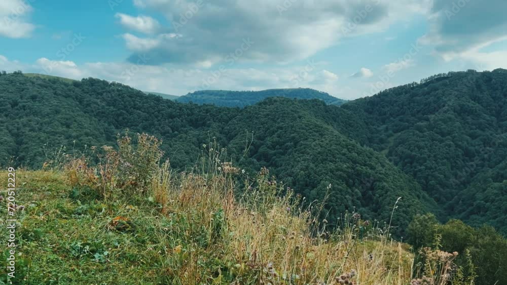 Gumbashi Pass, the highest mountain pass in Russia. View of the green mountains and hills at sunset. Beautiful summer landscape in the North Caucasus. Beautiful epic view of the valley.Evening