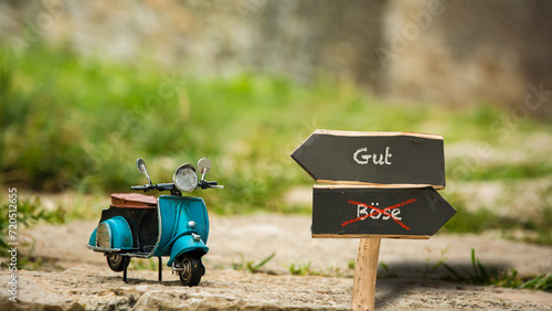 Foto Signposts the direct way to Good versus Evil