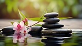 Zen stones, bamboo, flower and water in a peaceful zen garden, relaxation time, wellness and harmony, massage, spa and bodycare concept