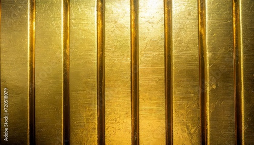 Golden background with copyspace. Textured metallic surface of gold bars. 