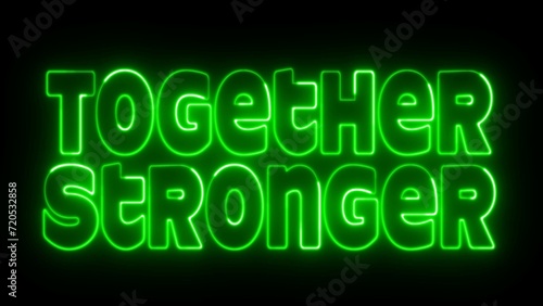 Together Stronger text font with neon light. Luminous and shimmering haze inside the letters of the text Together Stronger. Together Stronger neon sign.