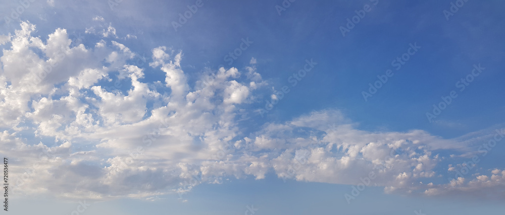 Blue sky with fluffy white cloud, weather background