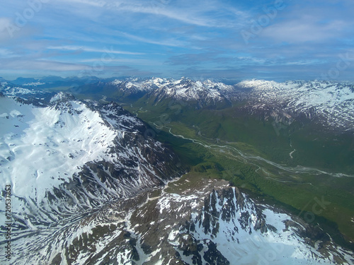Lake Clark National Park in Alaska. Drift River Valley in Chigmit Mountains and Aleutian Range. Braided alpine rivers full of snowmelt. Aerial view over rugged and remote mountains. 