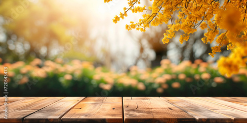 Empty wooden table in front spring mimosa flowers blurred background banner for product display in a coffee shop, local market or bar