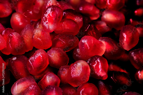 Wet seeds, pomegranate berries in macro photography