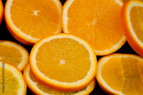 Sliced       orange slices close-up on a black background