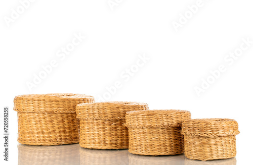 Several straw baskets, macro, isolated on white background.