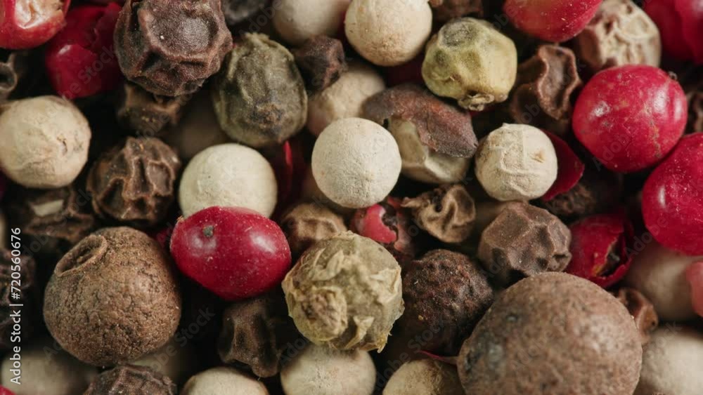 Mix dried pink, black and white pepper close-up macro. A bunch of natural pink pepper peas hot spice.Seasonings and condiments concept Mix dried pink, black and white pepper close-up macro. A bunch of natural pink pepper peas hot spice.Seasonings and condiments concept