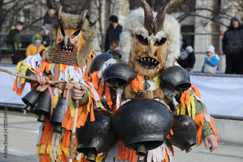Pernik, Bulgaria - January 26, 2024: International masquerade festival Surva in Pernik, Bulgaria. People with mask called Kukeri dance and perform to scare the evil spirits. © georgidimitrov70