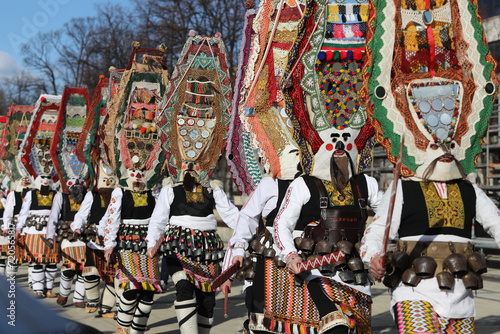 Pernik, Bulgaria - January 26, 2024: International masquerade festival Surva in Pernik, Bulgaria. People with mask called Kukeri dance and perform to scare the evil spirits.