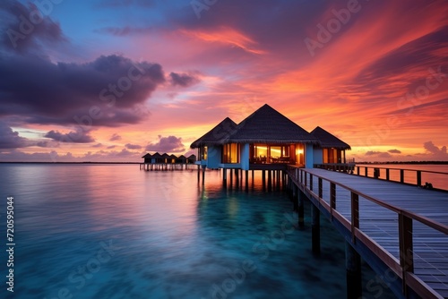 Pier With Hut at Sunset on a Calm Waterscape With Vibrant Colors, Water bungalow, Sunset on the islands of the Maldives, A place for dreams, AI Generated © Ifti Digital