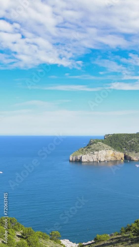 Small bay of Cala Montgo in Costa Brava. Montgo beach is a natural and awesome place of la Escala and Torroella de Montgri in Girona province, Catalonia, Spain. Vertical video photo