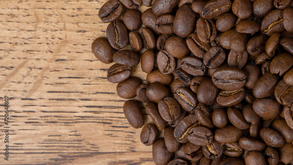 Coffee beans on wooden background. Top view with copy space Coffee beans on wooden background. Top view with copy space