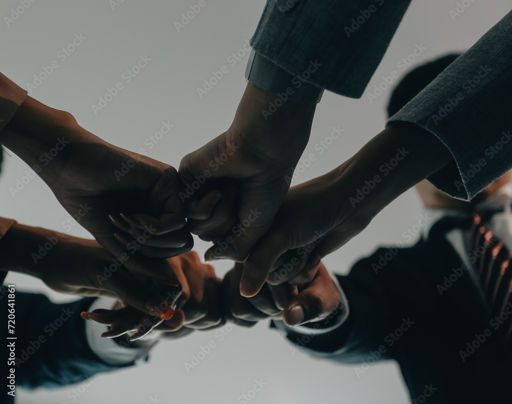 Group of college touch hands for unity group to success business. Group of college touch hands for unity group to success business.