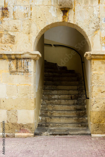 old stone arch with a staircase photo