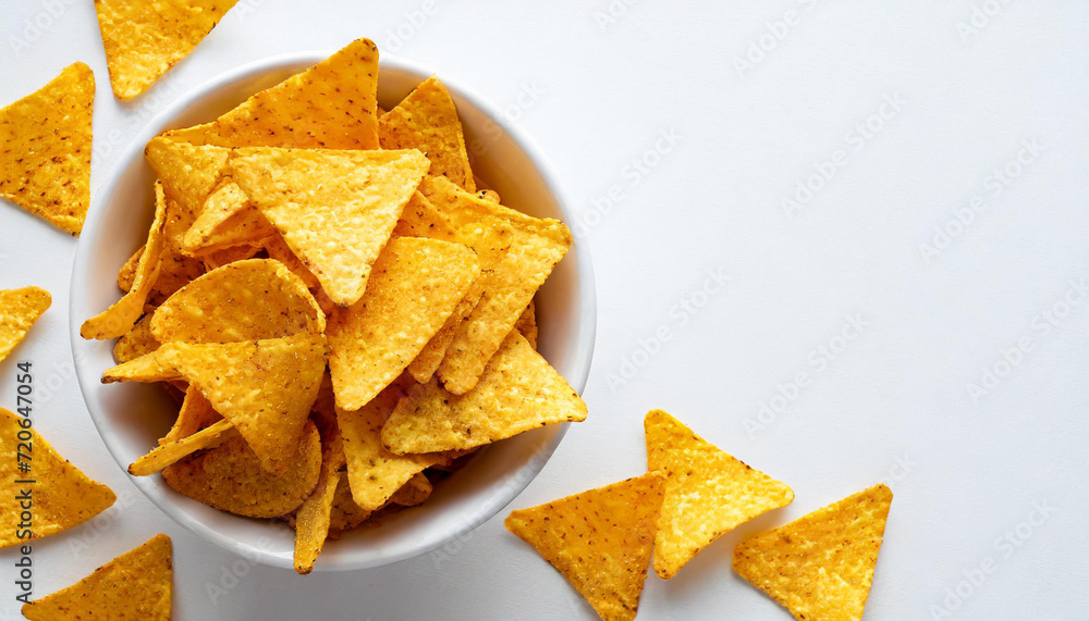 Corn chips nachos on white bowl, isolated on white background, copyspace on a side