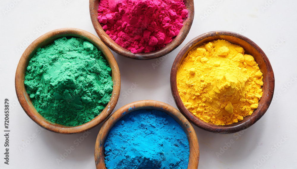 Holi color festival vibrant colours powder in bowls isolated on white background, top view Holi color festival vibrant colours powder in bowls isolated on white background, top view